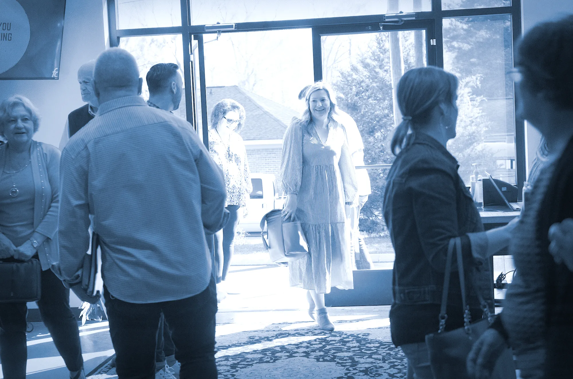 People greeting each other in the Freedom Church lobby